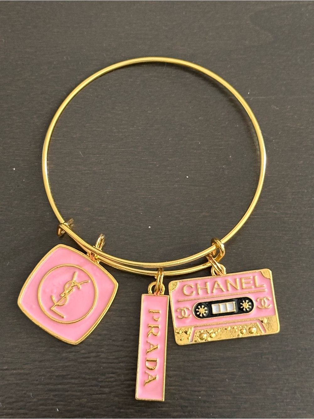 Gold-Tone Bracelet with Pink Logo Charms